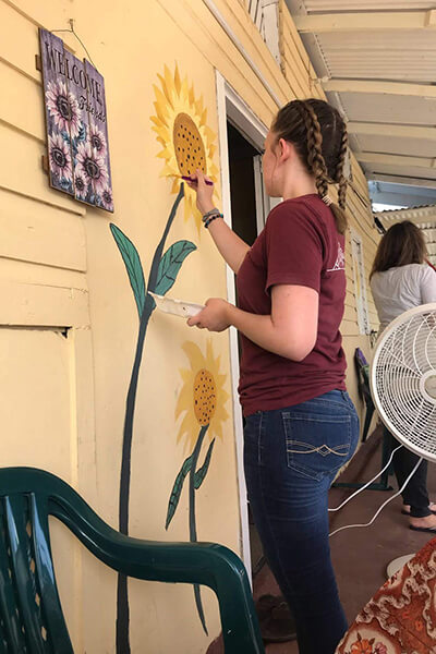 painting sunflowers on the house