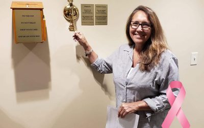 Tina Kadolph ringing the cancer-free bell